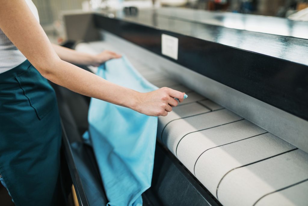 Person readying clothes to wash