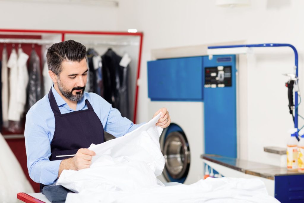 Man holding clothes to be washed